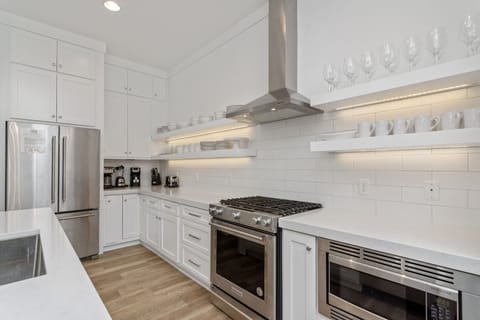 Gourmet kitchen stocked with all essential cooking and dining needs