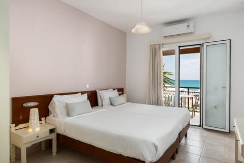 Apartment, 1 Bedroom, Sea View | 1 bedroom, in-room safe, iron/ironing board, free cribs/infant beds