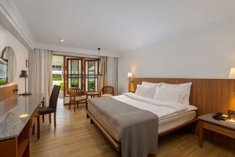 Deluxe Room, Terrace, Ground Floor | In-room safe, desk, blackout drapes, iron/ironing board