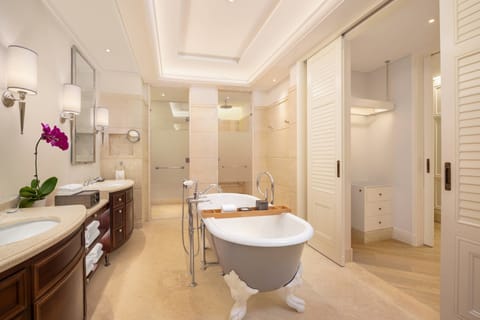 Family Studio, Multiple Beds, Balcony, Garden View | Bathroom | Separate tub and shower, rainfall showerhead, designer toiletries