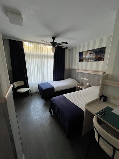 Economy Double or Twin Room, 2 Twin Beds | In-room safe, individually decorated, individually furnished, desk