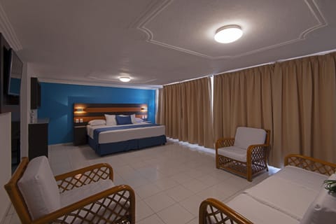 Junior Room, 1 King Bed, Sea View | Living area | Flat-screen TV