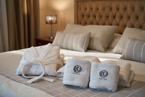 Premium bedding, down comforters, pillowtop beds, minibar