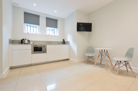 Lower Ground Floor Standard Studio | Private kitchen | Full-size fridge, microwave, stovetop, coffee/tea maker