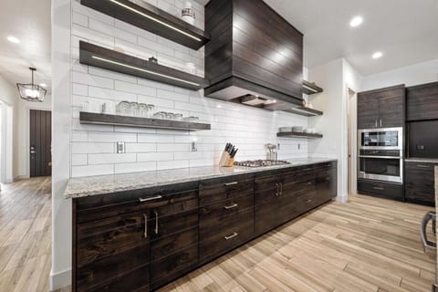 Kitchen is stocked with appliances and utensils