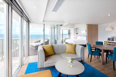 Deluxe Suite, Ocean View | Living area | 50-inch flat-screen TV with satellite channels, TV