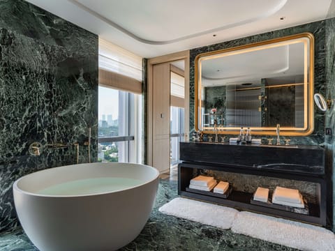 Ambassador Suite | Bathroom | Separate tub and shower, rainfall showerhead, hair dryer, bathrobes