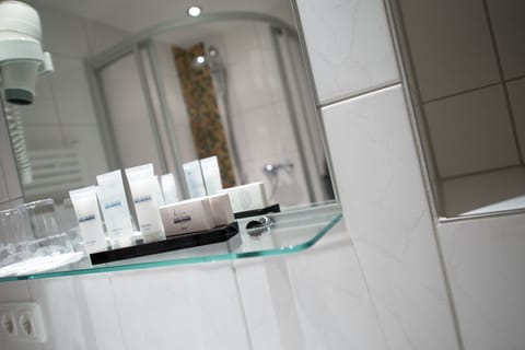 Shower, free toiletries, hair dryer, towels