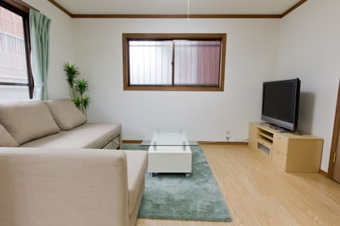 Three-Bedroom House | Living room | Flat-screen TV