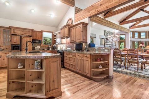 Steps away, the fully equipped kitchen features granite countertops.