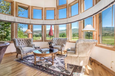 Stunning panoramic views of the golf course and mountains from the living room.