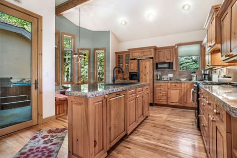 A separate patio hosts the private hot tub, perfect after a day on the mountain.