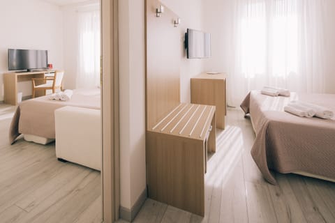 Deluxe Quadruple Room, 2 Bedrooms, Sea View | Minibar, in-room safe, desk, laptop workspace