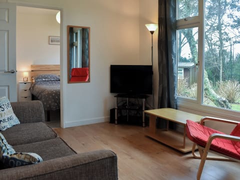 Comfortable living area and adjacent bedroom | Chalet 7 - Mount Hawke Holiday Bungalows, Mount Hawke, near Redruth