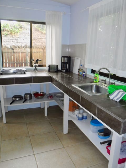 Studio Suite | Private kitchen | Fridge, stovetop, toaster, cookware/dishes/utensils