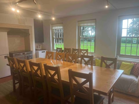 Kitchen and formhouse table which can be extended for the extra chairs