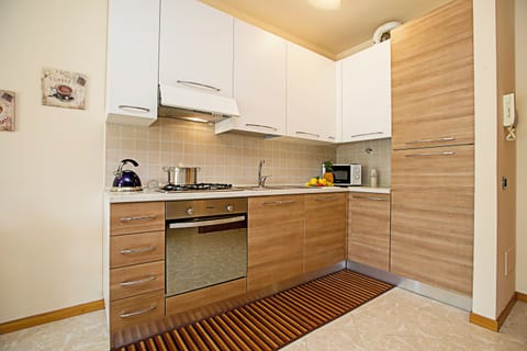 Family Apartment, 1 Bedroom (Casa Kristall Lago) | Private kitchen | Full-size fridge, microwave, oven, stovetop