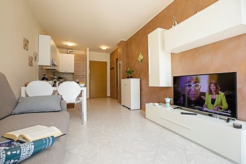 Family Apartment, 1 Bedroom (Casa Kristall Lago) | Living area | 21-inch flat-screen TV with cable channels, TV