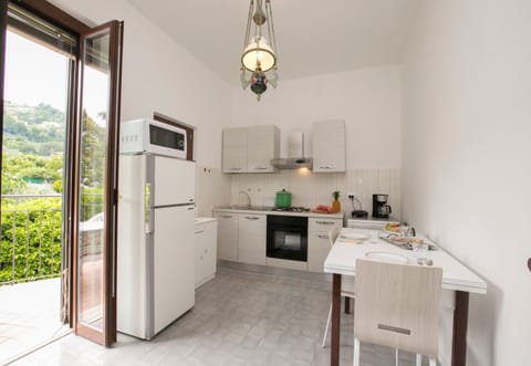 Family Villa, 6 Bedrooms (Villa Alberti 900m from Garda lake) | Private kitchen | Full-size fridge, microwave, oven, stovetop