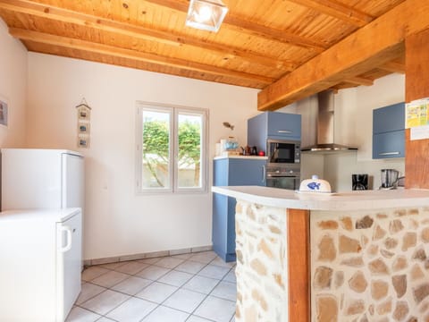 Property, Cabinetry, Countertop, Wood, Flooring, Architecture, Interior Design, Kitchen Appliance, Floor, Home Appliance