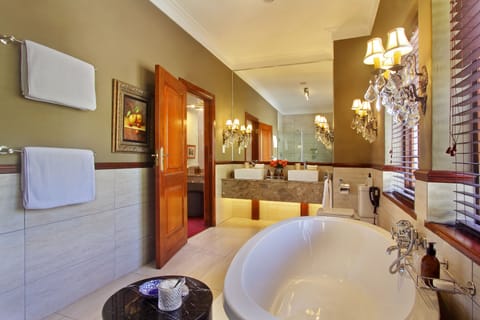 Luxury Suite, 1 Bedroom | Bathroom | Separate tub and shower, deep soaking tub, free toiletries, hair dryer