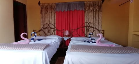 Classic Quadruple Room, 2 Queen Beds, Mountain View | In-room safe, blackout drapes, free WiFi, bed sheets