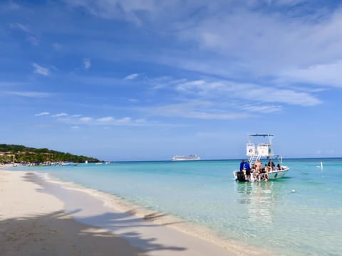 Beach nearby, white sand, sun loungers, beach umbrellas