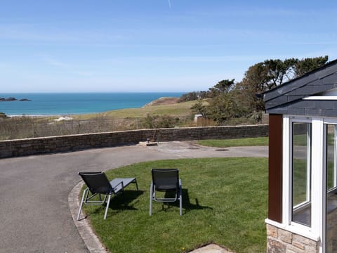 Sky, Furniture, Plant, Cloud, Water, Building, Land Lot, Outdoor Furniture, Shade, Grass