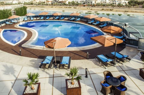 Outdoor pool, pool umbrellas, sun loungers