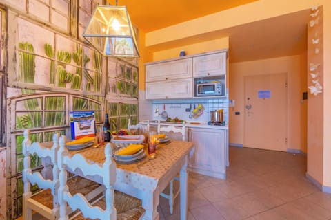 Family Apartment, 1 Bedroom, Sea Facing (Laigueglia Beach) | Private kitchen | Full-size fridge, microwave, oven, stovetop