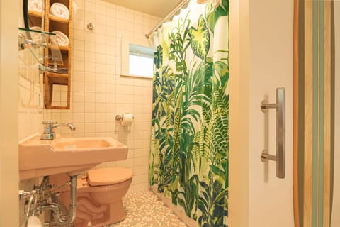 Deluxe King Studio Apartment | Bathroom | Designer toiletries, hair dryer, towels, soap