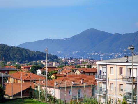 Sky, Building, Mountain, Window, Plant, Tree, House, Street Light, Urban Design, Cloud