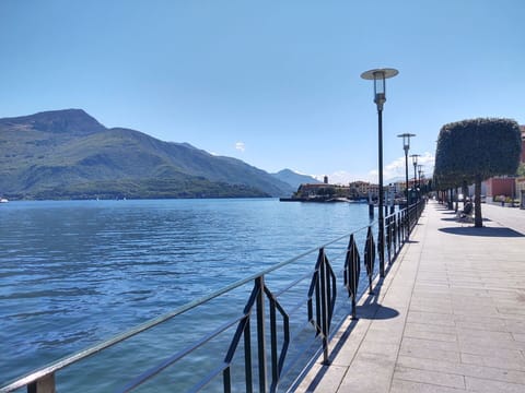 Sky, Water, Mountain, Fence, Street Light, Cloud, Lake, Waterway, Horizon, Landscape
