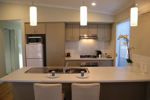 Two Bedroom Holiday Home (2BR) | Private kitchen | Microwave, stovetop, electric kettle, toaster