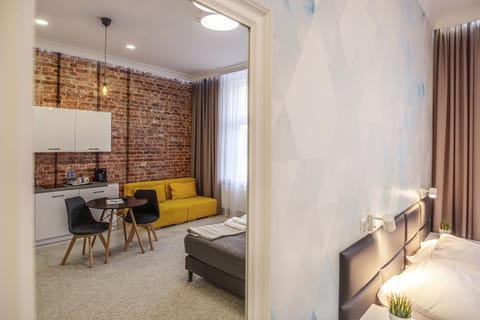 Deluxe Studio Suite, 1 Bedroom, Non Smoking, Kitchenette | Free minibar, desk, iron/ironing board, free WiFi