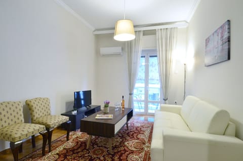 Apartment, 2 Bedrooms, Balcony | Living room | Flat-screen TV