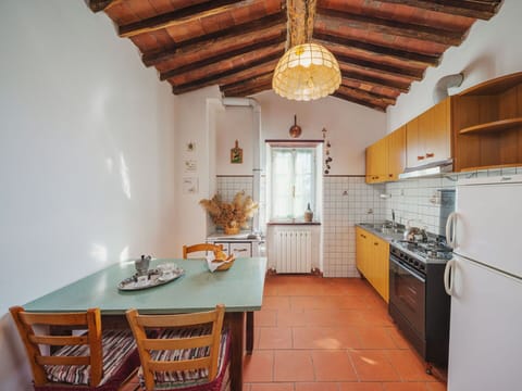 Furniture, Cabinetry, Property, Countertop, Wood, Table, Orange, Lighting, Chair, Interior Design