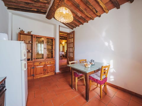 Furniture, Table, Cabinetry, Wood, Building, Orange, Interior Design, Chair, Floor, Wood Stain