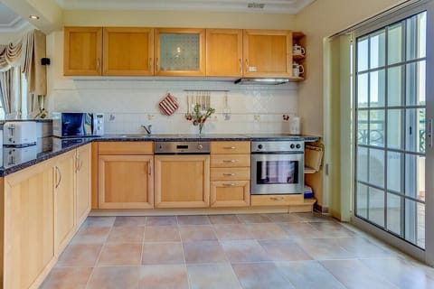 Apartment, 3 Bedrooms, Sea View | Private kitchen | Full-size fridge, microwave, stovetop, dishwasher