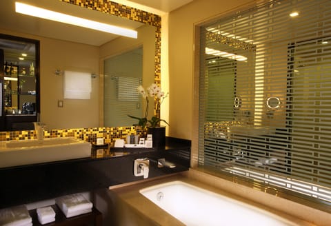 Executive Room, 1 King Bed, City View | Bathroom | Combined shower/tub, rainfall showerhead, designer toiletries