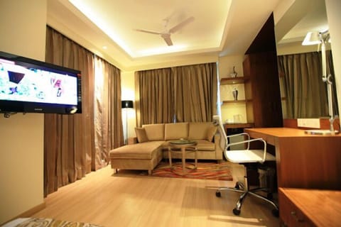 Junior Suite, 1 Double Bed | Living area | LCD TV