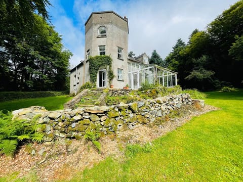 Glenbeg Tower showing terrace and surrounding gardens and woodlands