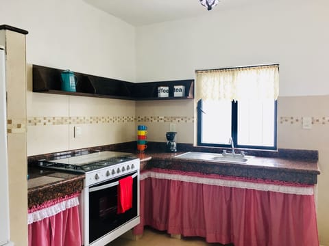 Villa | Private kitchen | Full-size fridge, microwave, oven, cookware/dishes/utensils