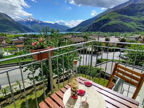 Cloud, Mountain, Sky, Plant, Property, Building, Flowerpot, Fence, Natural Landscape, Table