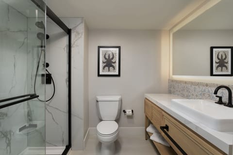 Combined shower/tub, designer toiletries, hair dryer, slippers