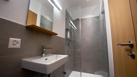 Shower, hair dryer, towels, toilet paper