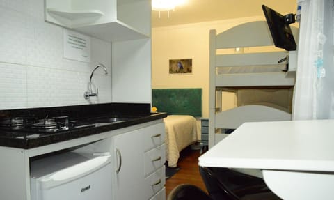 Family Quadruple Room | Private kitchenette | Full-size fridge, microwave, stovetop, toaster