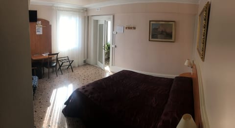 Classic Double or Twin Room | Down comforters, desk, laptop workspace, iron/ironing board