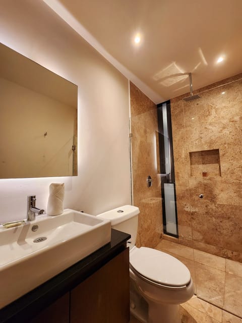 Deluxe Studio | Bathroom | Shower, designer toiletries, hair dryer, heated floors