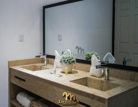 Shower, rainfall showerhead, towels, soap